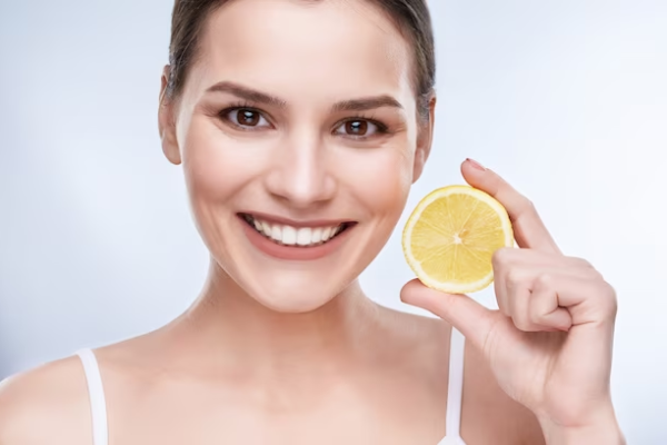 A girl using lemon for Skin Brightening Remedies